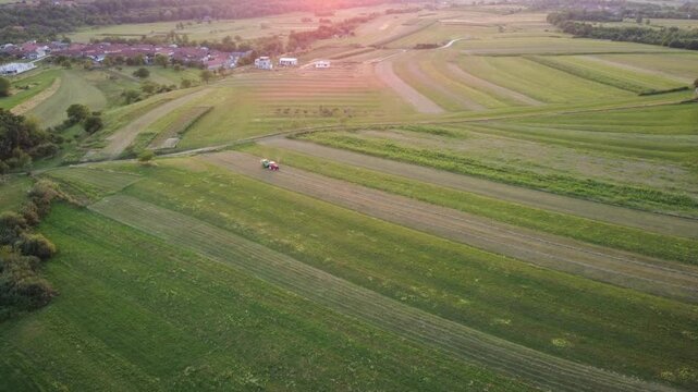 Aerial View of Tractor Working on Green Fields. Agriculture Work. 