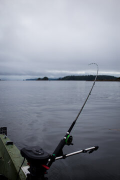 A fishing rod on the side of a boat off the coast of Vancouver Island