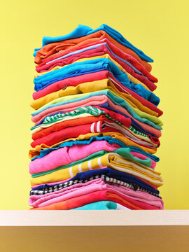 Stack of  neatly folded, multicoloured clothing 