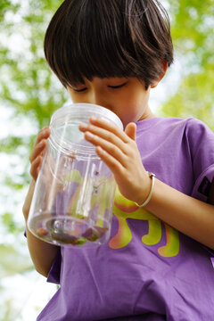 Chinese boy explores natural plants in the jungle