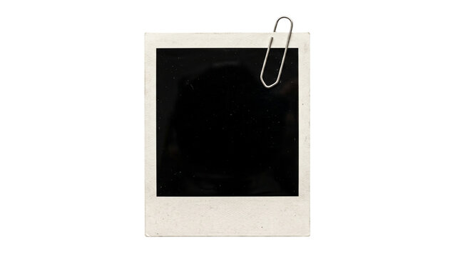 Instant photograph with silver paper clip attached white frame and dark reflective surface on transparent background photo polaroid picture snapshot