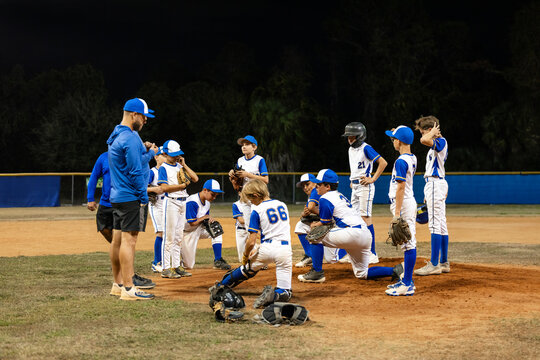 Coach Talks to Players at Practice