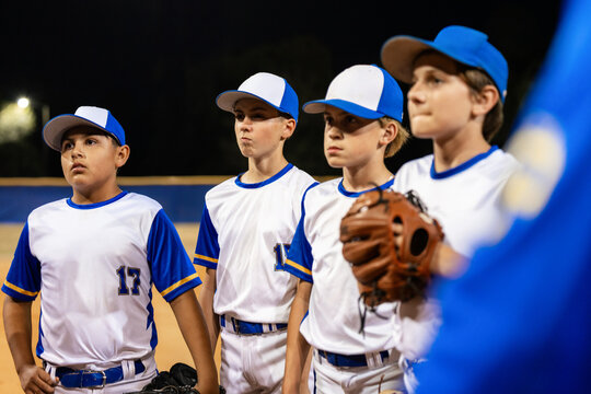 Team Shares Ideas During Baseball Game Time