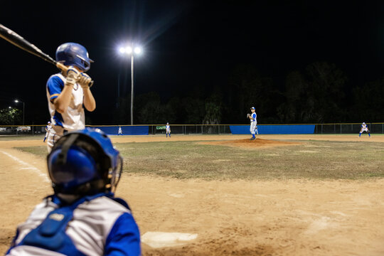 Batter and catcher waiting for the pitcher's throw