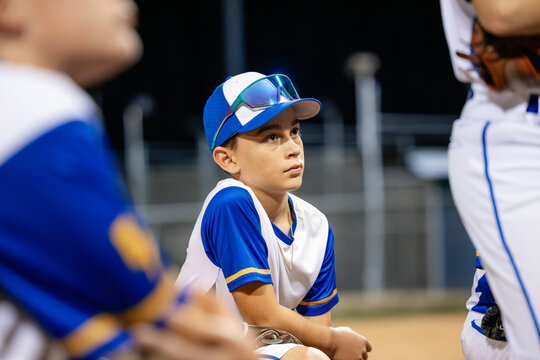 Coach Talks to Young Baseball Team