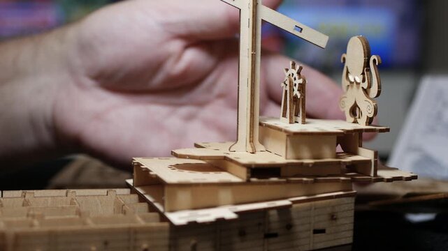 Detailed Wooden 3D Puzzle Ship Construction Closeup. Creative DIY Wooden Steampunk Ship Model Building