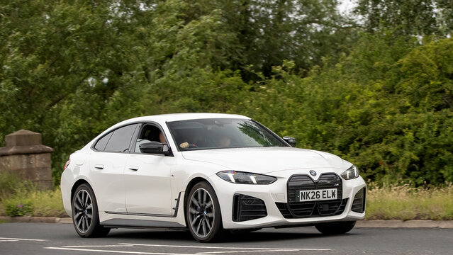 Stony Stratford,Bucks,UK - June 7th 2026: 2026 white BMW i4 m60 electric car driving on a British road