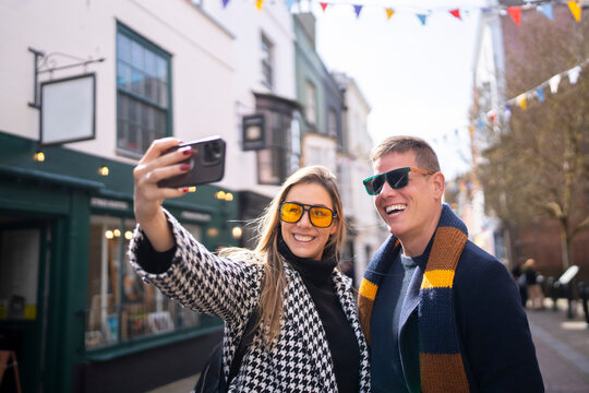 Happy travel couple taking selfie