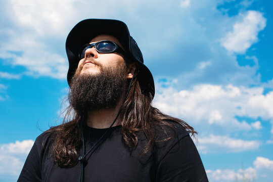 Man in sunglasses enjoy warm summer day