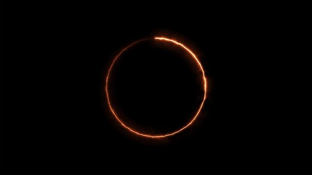 Animated glowing orange circle rotates on black background with copy space for text