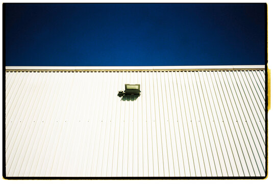 White Metal Wall with Blue Sky
