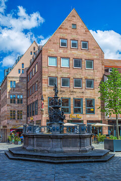 NUREMBERG, GERMANY-APRIL 30, 2023: Tugendbrunnen, the Fountain of Virtue, located in Lorenzer Platz, was built 1584-1589 by the ore foundry Benedikt Wurzelbauer. One of the landmarks of the city.