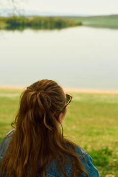 Woman with her back to us, looking up