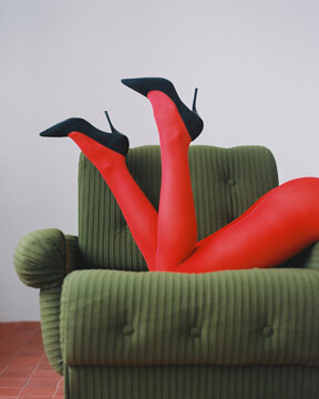 Legs in heels and red tights