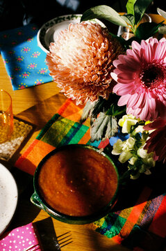 Colorful Bowl of salsa Surrounded by Flowers