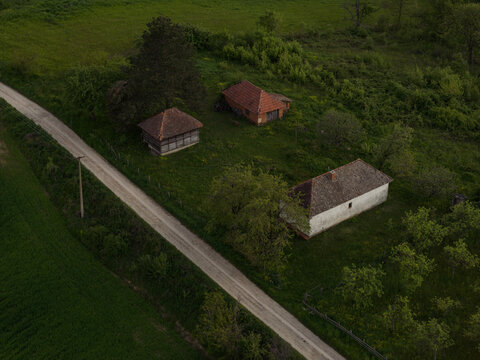 Traditional Serbian Rural Homestead Surrounded by Green Countryside