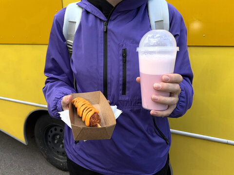 UGC carring fast food with milk shake