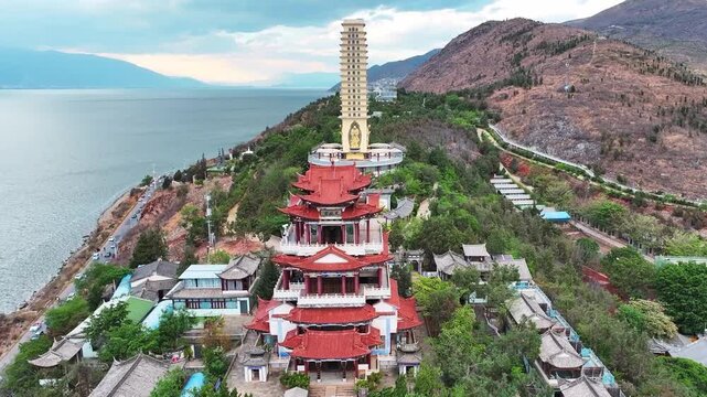 Buddhist Temple Complex on a Hillside by a Lake