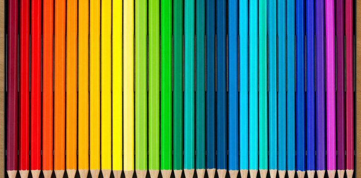 Rainbow collection of colored pencils lined up in a perfect spectrum gradient with spectrum gradient stationery creative colorful supplies education alignment parallel materials