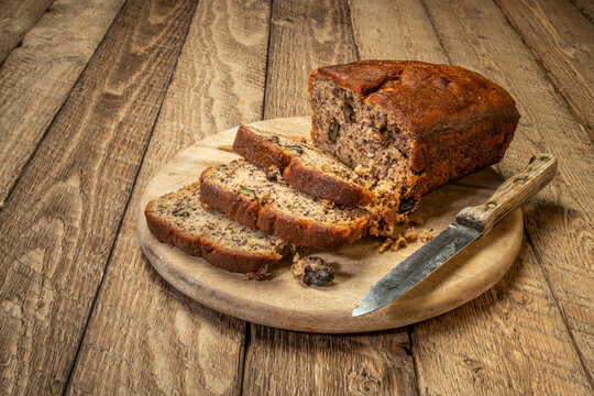 slices of fresh banana bread with walnut on a cutting board