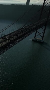25 de Abril Bridge Cinematic Drone Footage Above the Tagus River in Summer. Lisbon Portugal