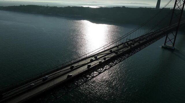 25 de Abril Bridge Cinematic Drone Footage Above the Tagus River in Summer. Lisbon Portugal