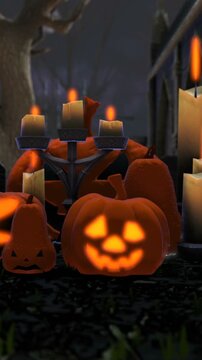 vertical video of pumpkins and candles in a cemetery at night. Halloween background. Zoom in.