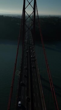 25 de Abril Bridge Cinematic Drone Footage Above the Tagus River in Summer. Lisbon Portugal