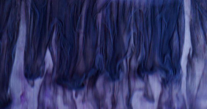 Ink drip. Color fluid. Defocused blue trickle water splash acrylic chemical texture liquid spilling on abstract creative background.