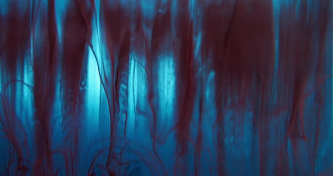 Flowing paint. Mist swirling. Defocused blue maroon red colorful water acrylic drip fluid vapor wave floating on abstract art background.