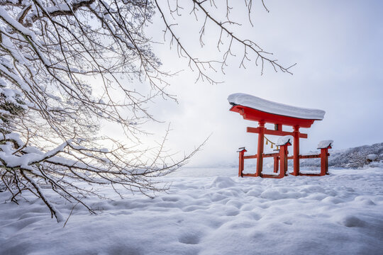 Red torii gate in winter, Gozanoishi Shrine, Akita Prefecture, Japan