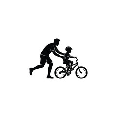 Obraz premium Silhouette of a father teaching his child how to ride a bicycle