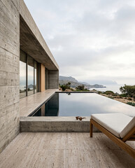 Fototapeta premium Luxury villa exterior with infinity pool and ocean view copy space