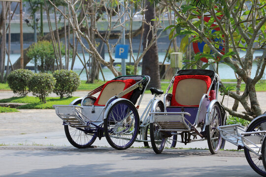 Empty cyclo rickshaw carts in Hue, Vietnam