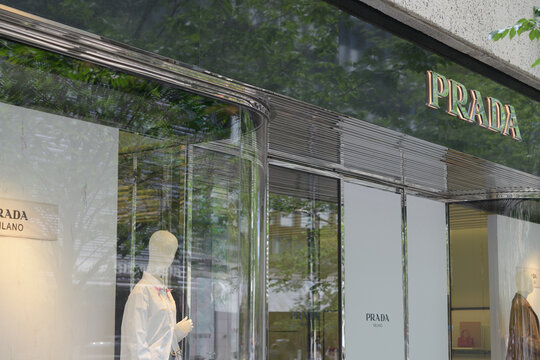 exterior building facade and sign of Prada, a luxury clothing store, located at The Colonnade, 131 Bloor St W, Toronto