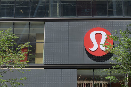 logo sign on the exterior of lululemon, a sportswear store, located here at 2 Bloor St W, Toronto