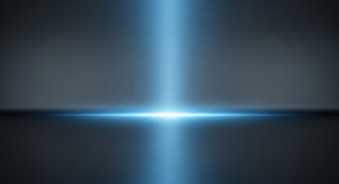 Intense vertical and horizontal blue light beams intersect upon a dark, reflective surface