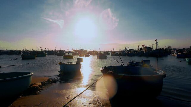 Vietnamese Fishing Harbor with Basket Boats Under Bright Sun Glare