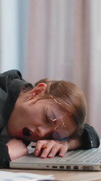 Bored sleepy Caucasian business woman worker working on laptop computer yawning leaning on hand falling asleep at office. Exhausted tired freelancer workaholic lady. Employment, occupation, workless