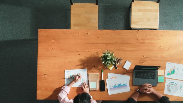 Top view of business team attend meeting while prepare working and analyzing data. Group of diverse people planning creative and working on start up project while team joining conference. Convocation.