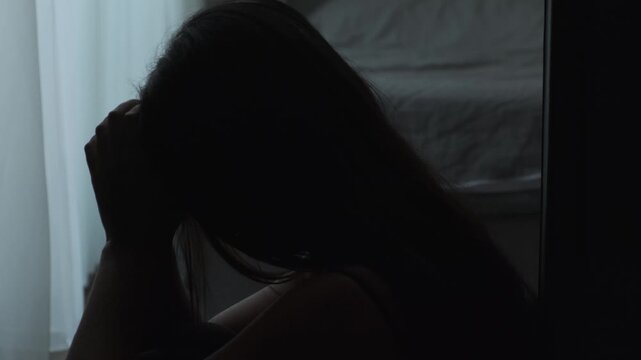 Close up of heartbroken woman after breakup, emotional pain, loneliness and digital heartbreak in authentic everyday home environment