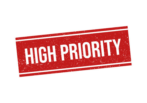 Red grunge rubber stamp with the text high priority on flat surface