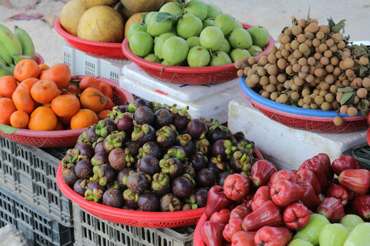Tropical fruit baskets at market stall in Vietnam
