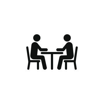 Two people sitting at a table across from each other talking vector icon
