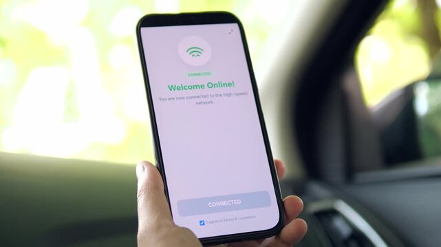 Modern traveler connecting to public Wi-Fi inside a car. Hand clicking Connect Now and receiving a Welcome Online message. High-quality footage for digital connectivity and mobile technology concepts