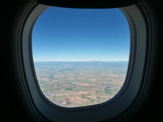 Naklejka premium View of Indian Peaks Wilderness Through an Airplane Window After Departure from Denver Colorado
