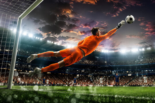 Dynamic Goalkeeper Leap Saving Football Goal in Stadium at Dusk