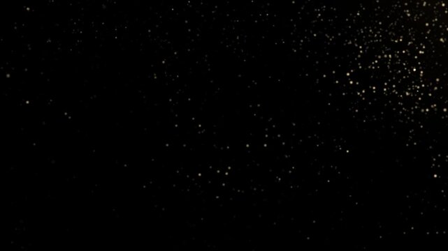 Golden glitter line animation with sparkling light particles on black background,  fairy dust wand glitter stars trail transition gold dust trail, elegant bokeh glow overlay video.