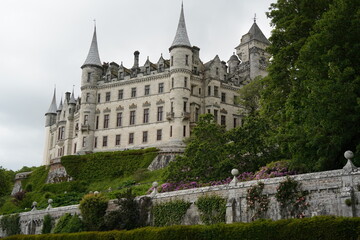 Obraz premium Gothic Revival Castle with Tall Turrets on Hilltop