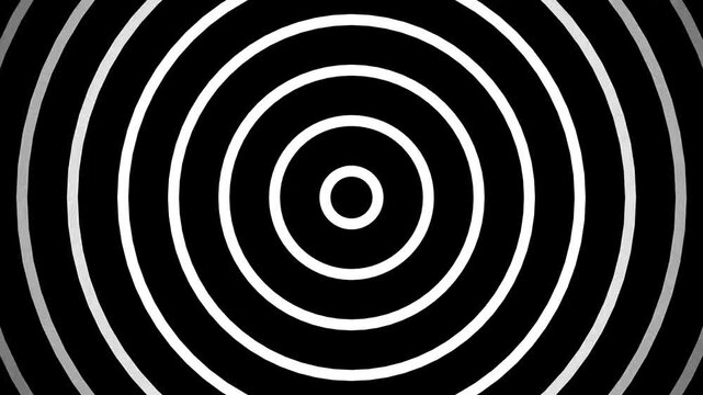 Pulsing monochromatic concentric circle patterns in motion